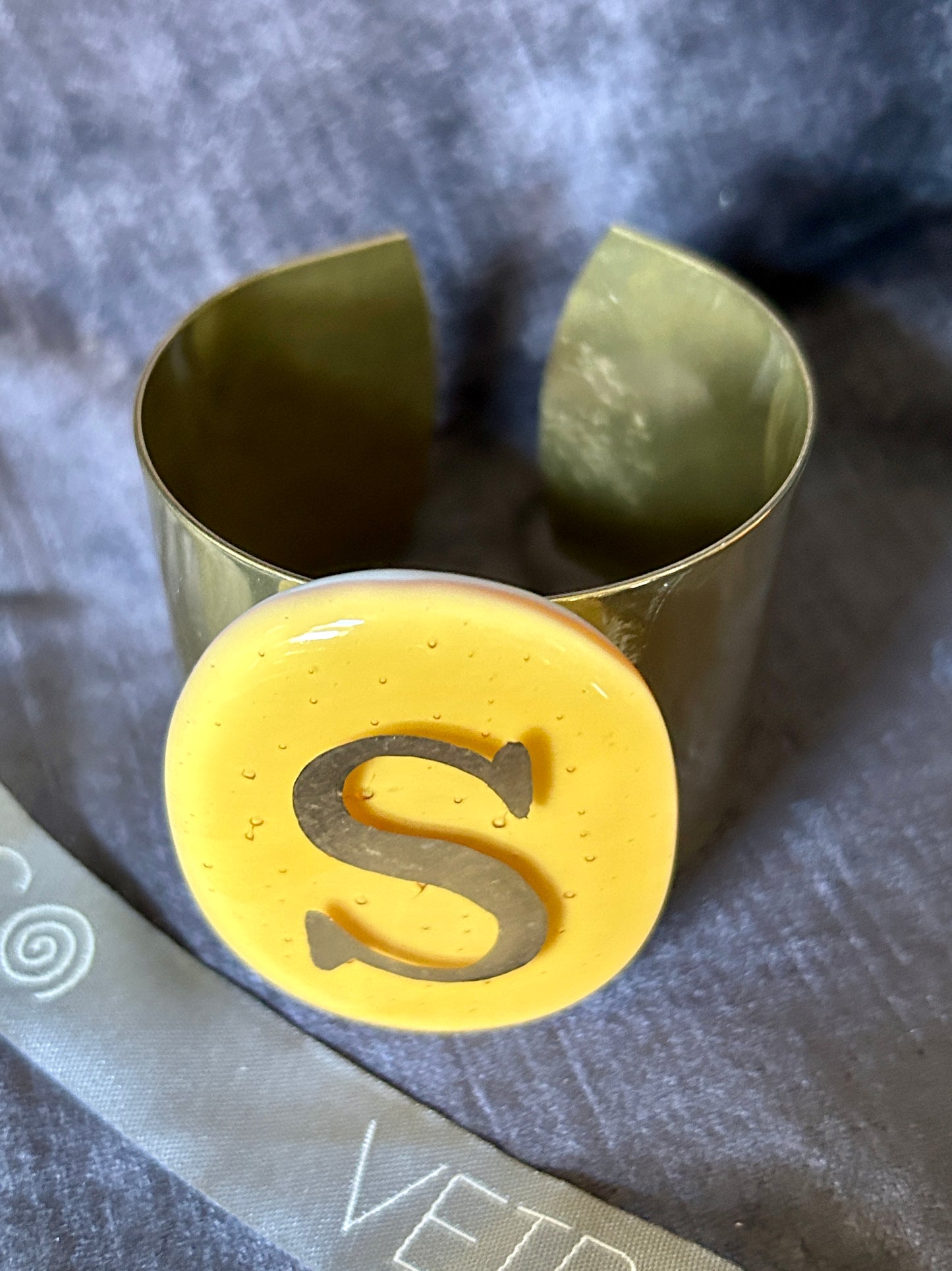 Gipsy bracelet letter S on oval Ocher Daniela Poletti can be ordered