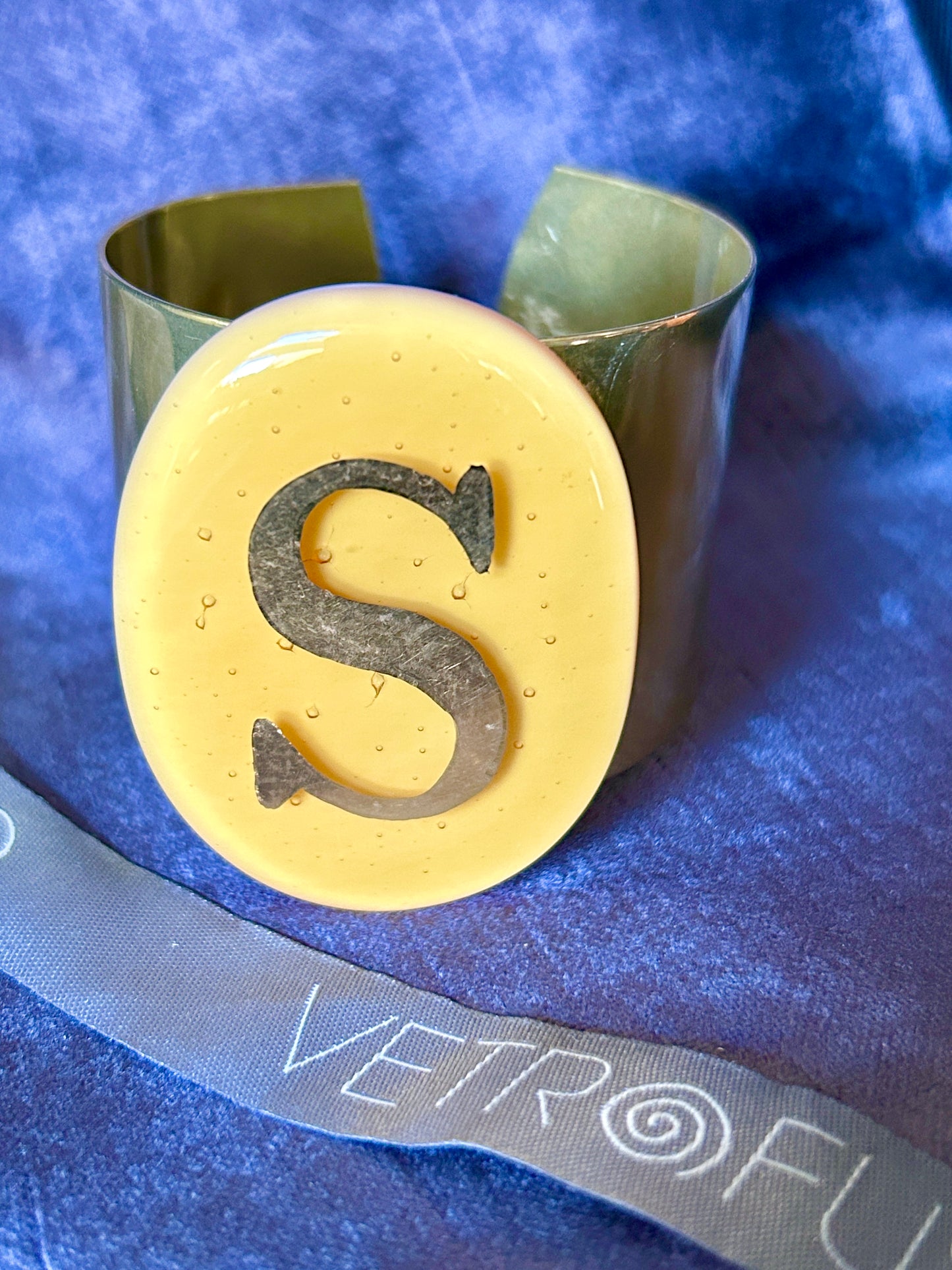 Gipsy bracelet letter S on oval Ocher Daniela Poletti can be ordered
