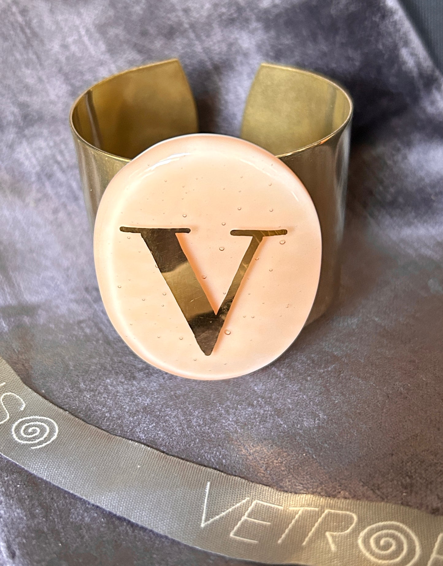 Gipsy letter V bracelet on champagne oval Daniela Poletti can be ordered