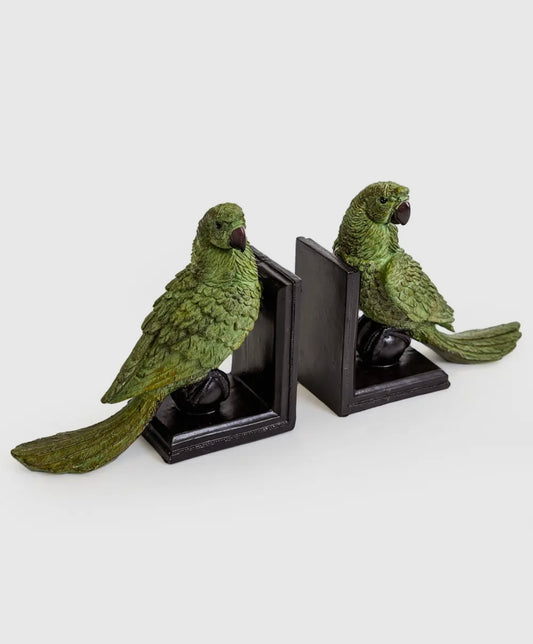 Coppia di fermalibri verdi a forma di pappagallo su sfera