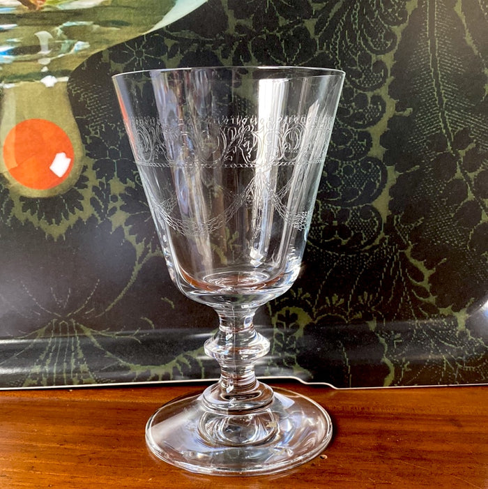 Six pantographed wine glasses