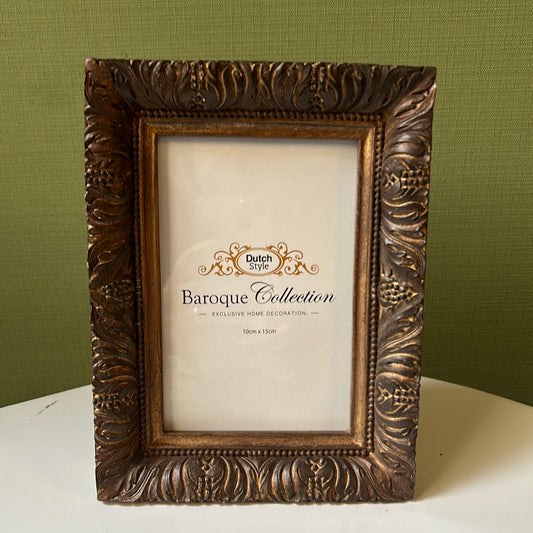 Wooden photo frame with leaves