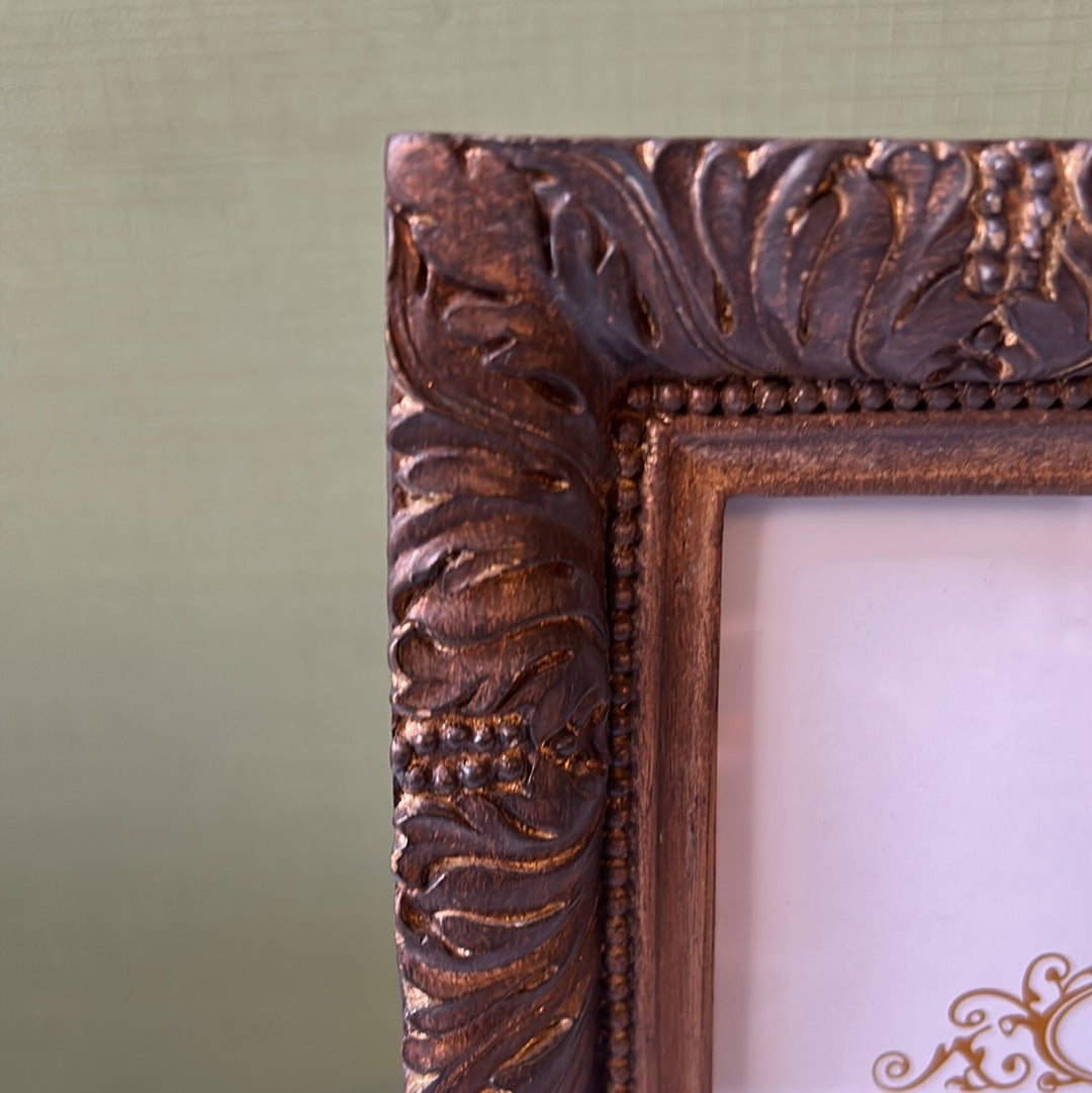 Wooden photo frame with leaves