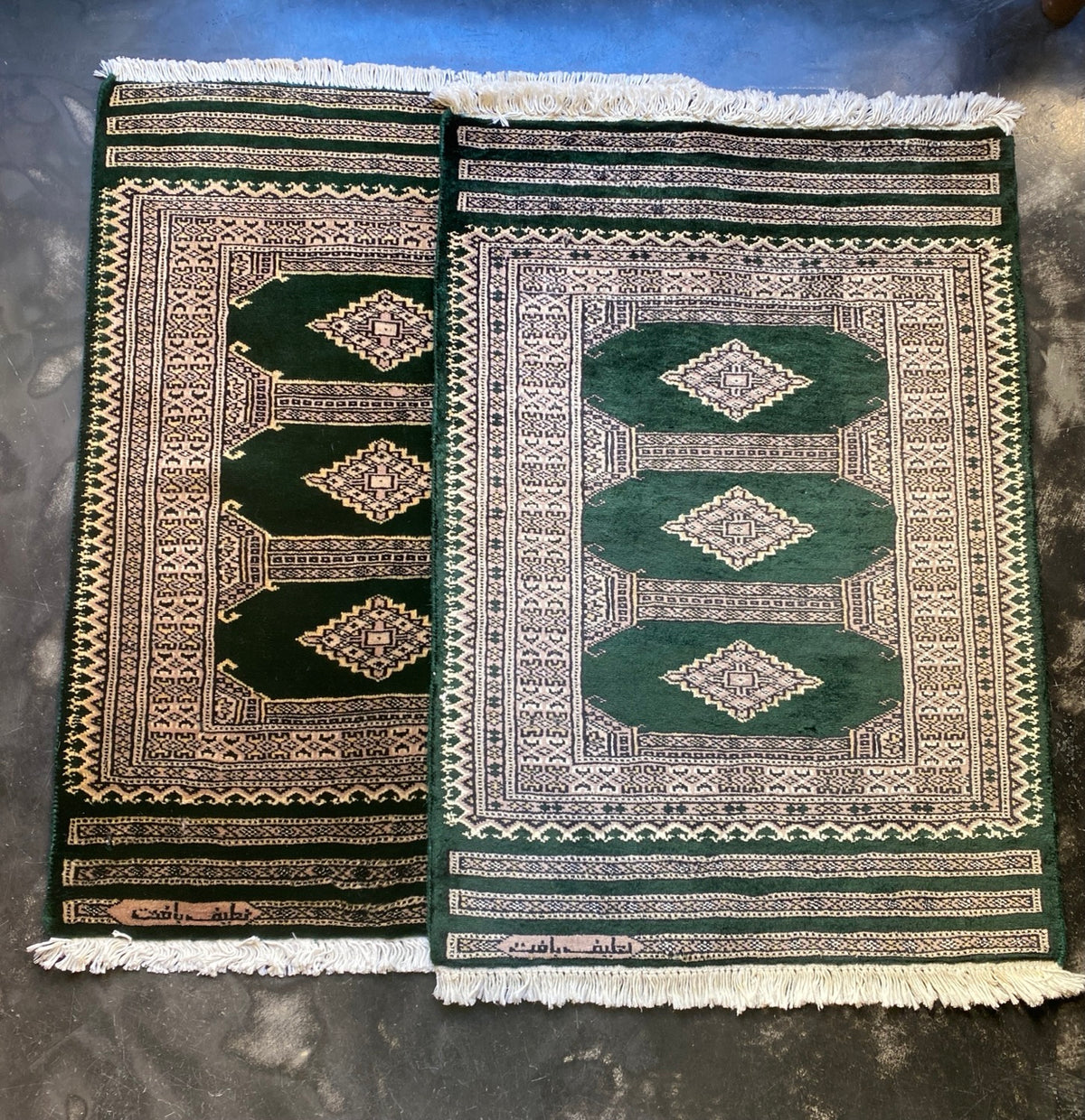 A green Boukara Kashmir rug