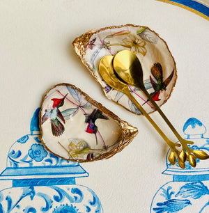 Salt and pepper shells with teaspoons